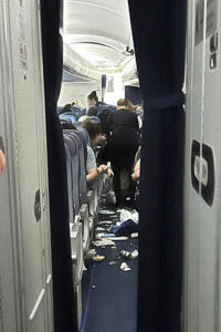 Food trays and trash on ground of plane