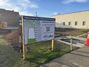 A sign tracking the progress of donation funding for the town square in Buena Vista