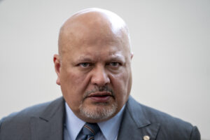 Karim Khan frowns