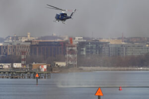 Photo of a US Park Police helicopter during the search and rescue efforts in the Potomac River.