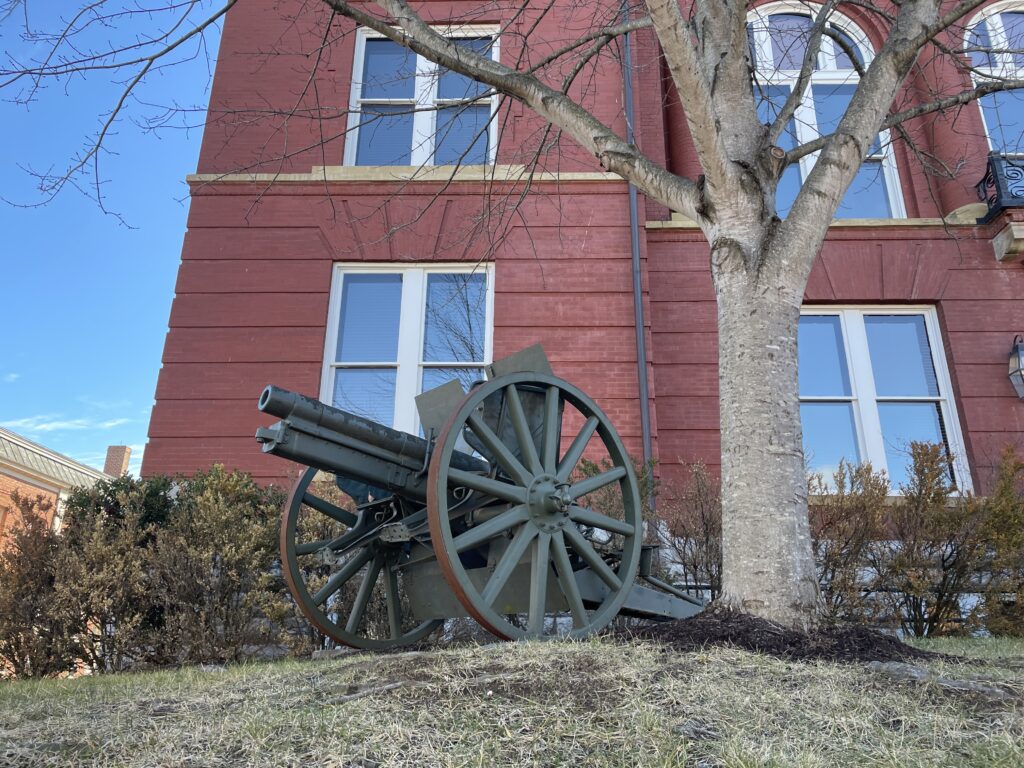 Sidewalk view of World War I cannon.