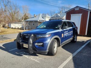 Photo of a Lexington Police Department car sitting outside the police headquarters.