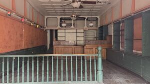 Street view image of emptied building and dining area.