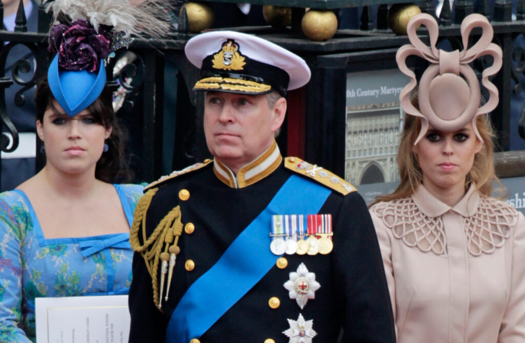 Britain's Prince Andrew, center, and his daughters Princess Eugenie, left, and Princess Beatrice leave Westminster Abbey after the wedding of Prince William.