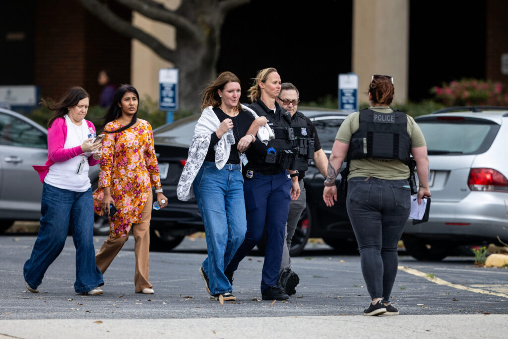Bystanders are evacuated from Old Dominion University's campus after reports of an active shooter.