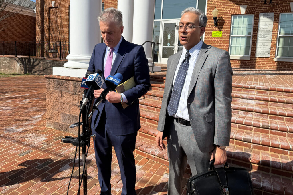 Hammad Matin, right, and Andrew Jezic, left. speak to reporters outside the Charles County District Court. 