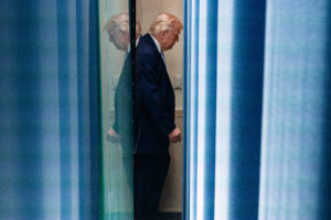 Trump walks between two blue walls