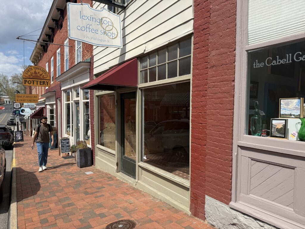An individual walks past the former Lexington Coffee Shop building in downtown Lexington. 